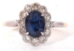 Sapphire and diamond ring, the oval cut sapphire 8 x 5.9mm, surrounded by a gallery of 12 bezel