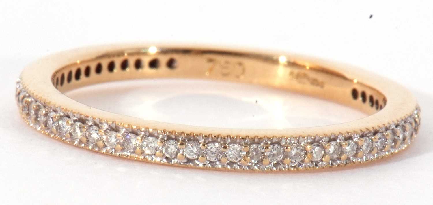 Modern diamond half eternity ring set with small single cut diamonds, stamped 750, size O