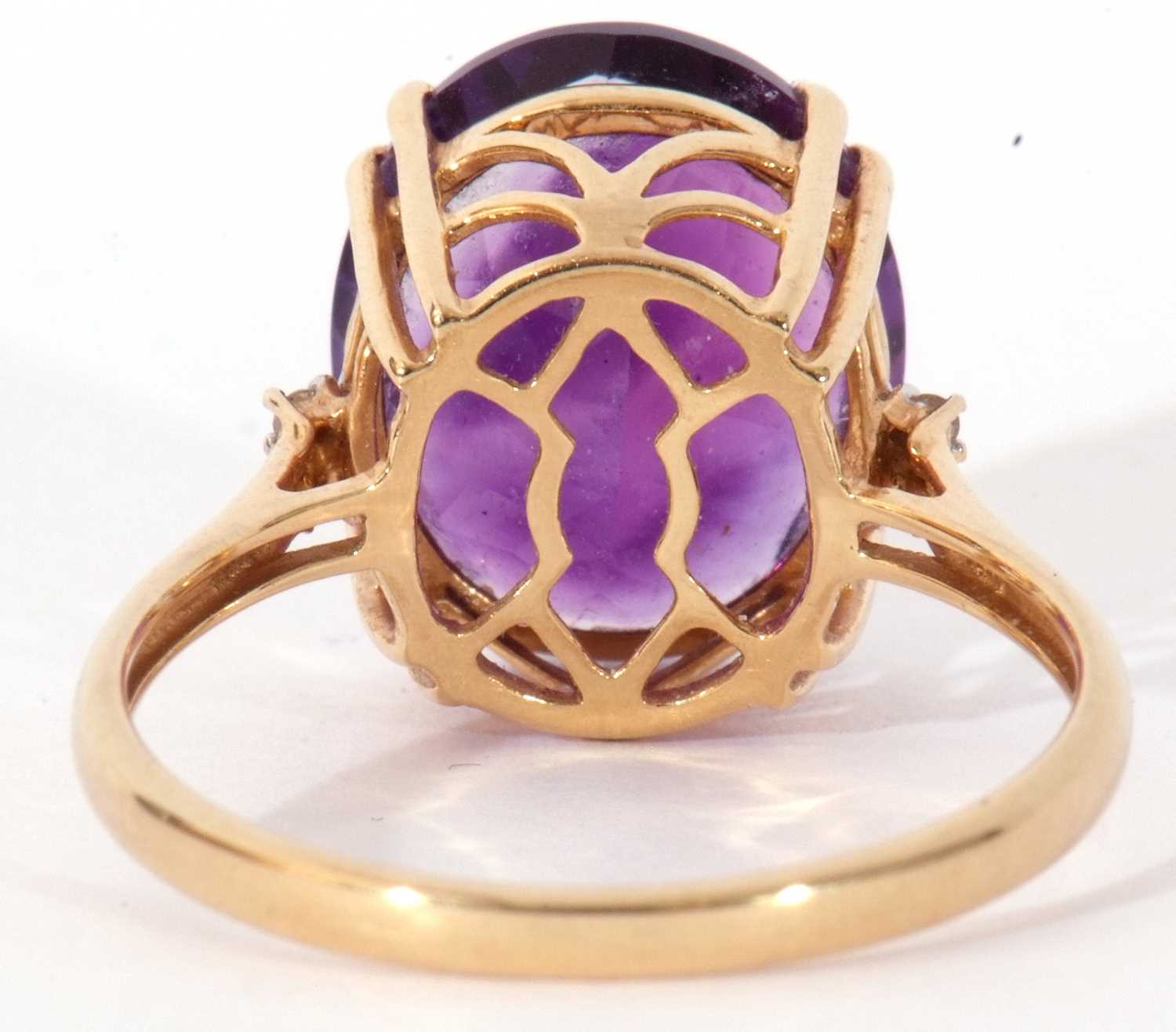 Modern 18ct gold, amethyst and diamond ring, the oval faceted amethyst four claw set and raised in a - Image 5 of 10