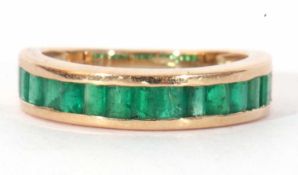 Modern 9ct gold and emerald half hoop ring featuring 15 small rectangular pave set emeralds, size