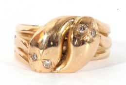 18ct gold and diamond snake ring, a design featuring two serpent heads having small diamond set eyes