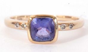 Modern 9ct gold, tanzanite and diamond ring, the square cut tanzanite in a rub-over setting,