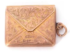 9ct gold stamp case in the form of an envelope, chased and engraved overall with initials engraved