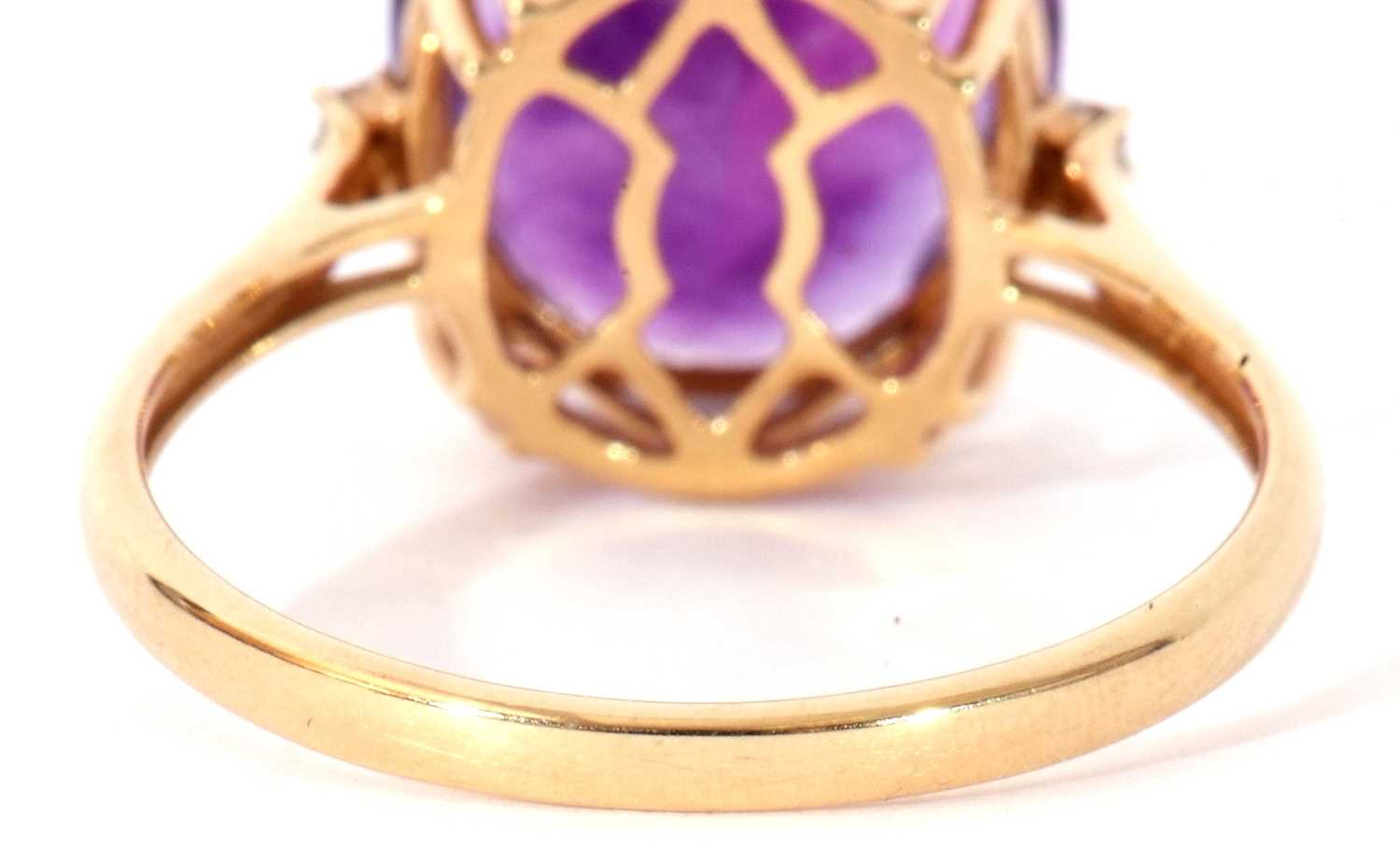 Modern 18ct gold, amethyst and diamond ring, the oval faceted amethyst four claw set and raised in a - Image 6 of 10