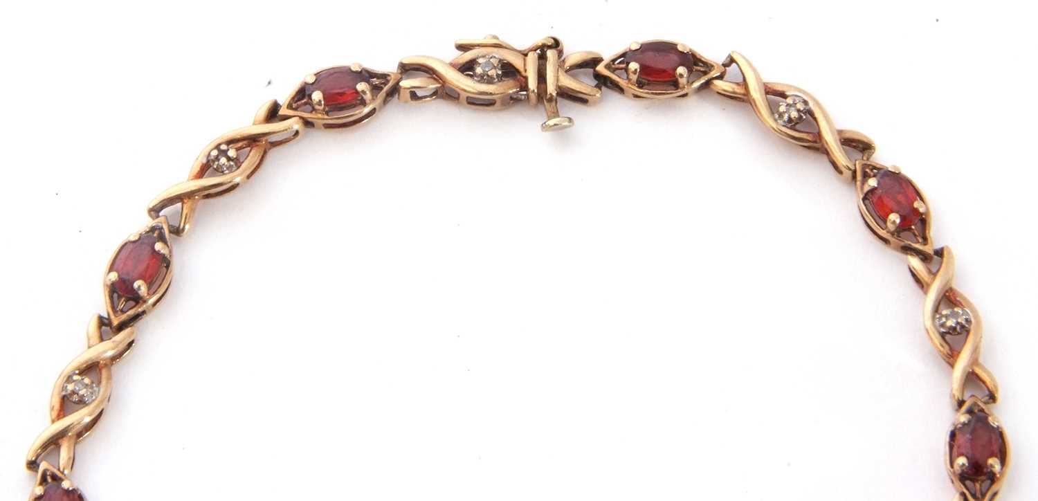 Modern 9ct gold and garnet small diamond line bracelet, alternate set with nine small oval cut - Image 3 of 6