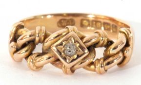 18ct gold and diamond ring, the top section an articulated chain design centring a small old cut