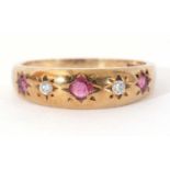 Vintage 9ct gold ruby and diamond set ring alternate set with three small round cut rubies and two