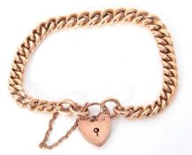 9ct rose gold curb link bracelet, each link stamped 9.375 and joined by a 9ct gold heart padlock,