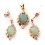 9ct gold, jade and diamond pendant, the pale celadon jade cabochon framed in a 9ct gold mount,