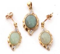 9ct gold, jade and diamond pendant, the pale celadon jade cabochon framed in a 9ct gold mount,