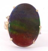 Modern 9ct gold iridescent stone dress ring, the large oval shaped stone 24 x 17mm, raised between