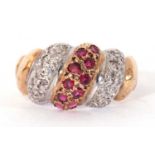 9ct gold ruby and diamond ring, the centre with a band of 10 small rubies between bands of small