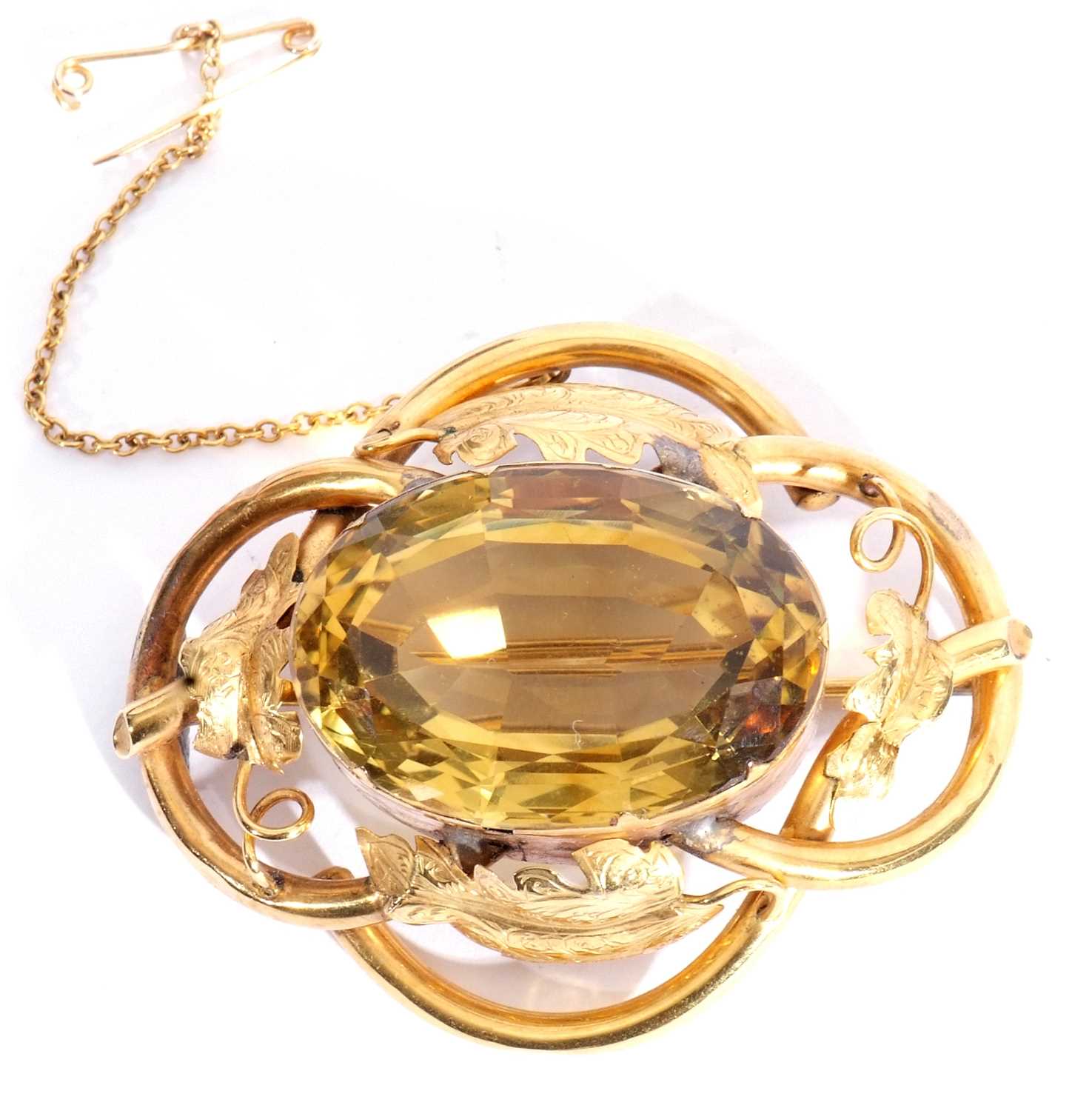 Antique gold and citrine brooch, the tubular and leaf decorated frame centring a large faceted lemon - Image 2 of 3