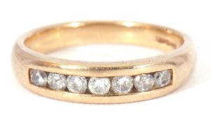 9ct gold and diamond half hoop ring featuring seven small channel set round cut diamonds, size N