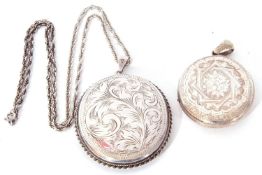 Mixed Lot: large silver hinged locket of oval shape, chased and engraved back and front,