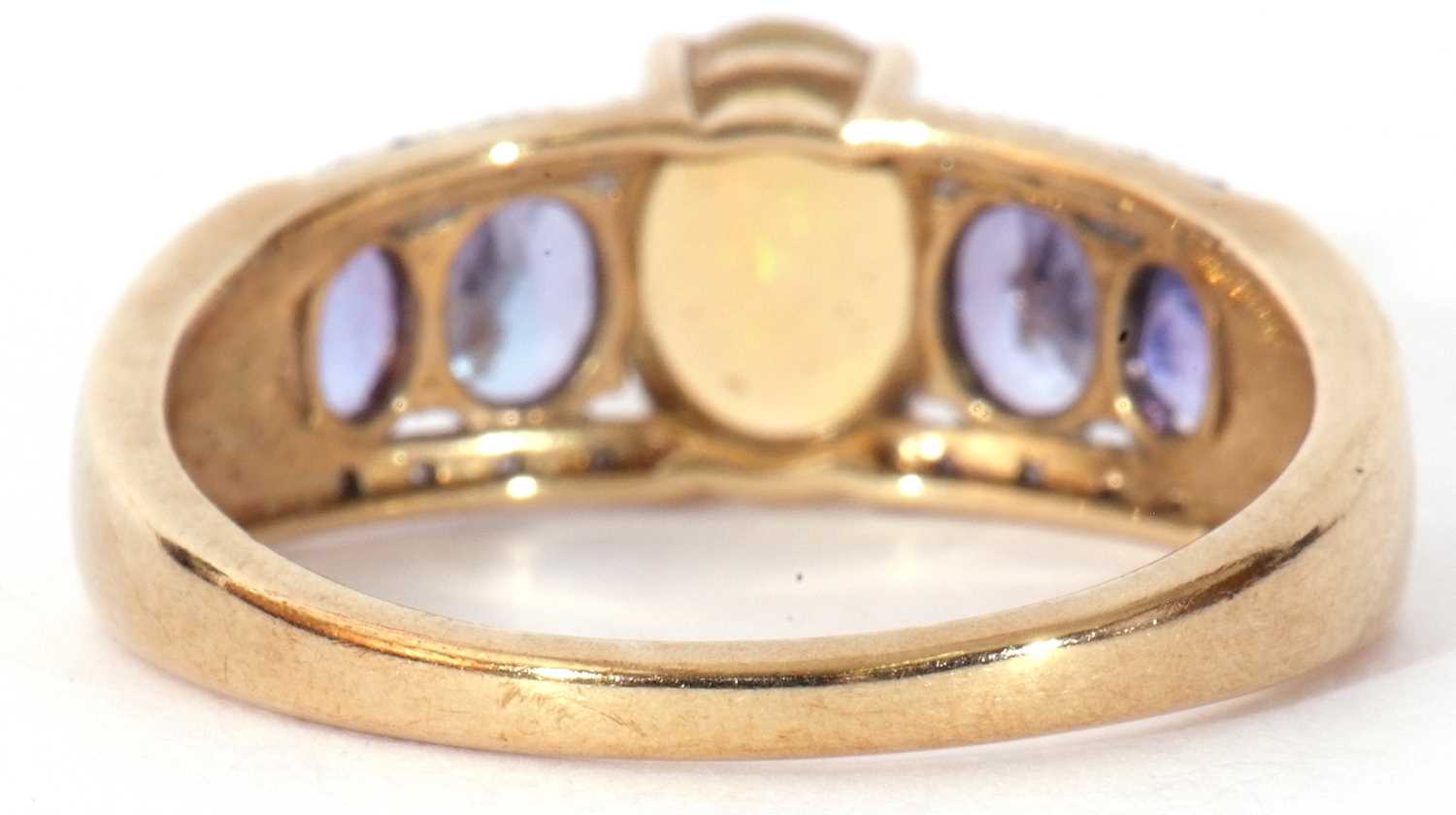 Modern 9ct gold, opal, tanzanite and diamond ring, the oval cut opal raised above a tanzanite and - Image 5 of 8