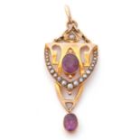 An amethyst and seed pearl open work pendant centring an oval faceted amethyst sitting above a