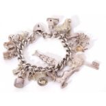 Silver curb link bracelet suspending various white metal charms, 108gms g/w