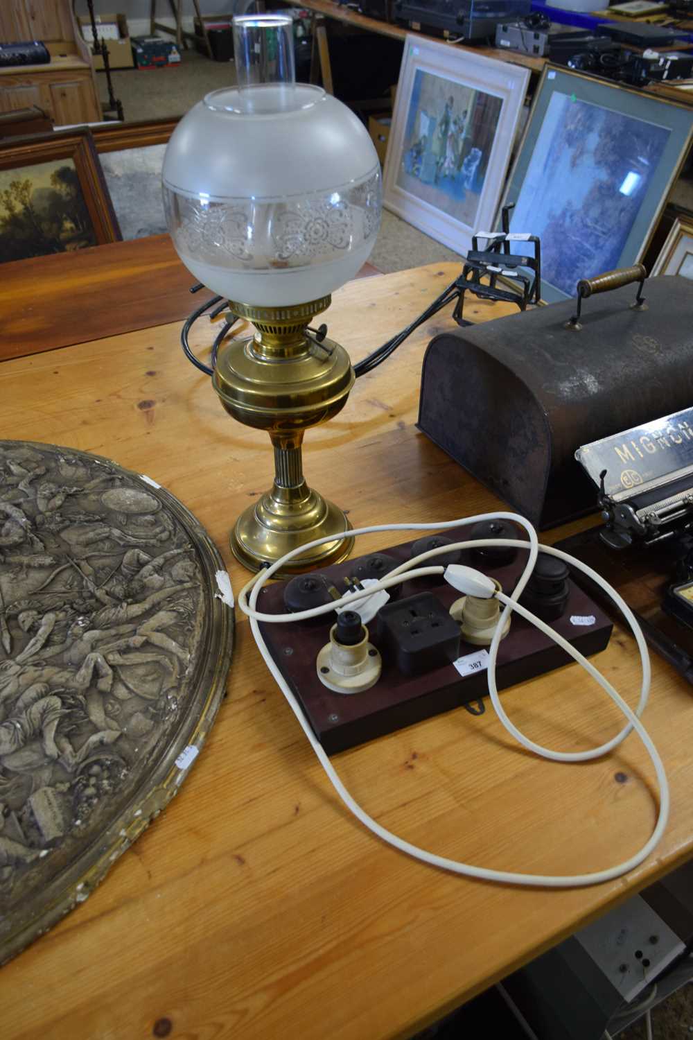 BRASS BASED OIL LAMP WITH LATER ELECTRICAL CONVERSION, TOGETHER WITH A BOARD OF VINTAGE ELECTRICAL