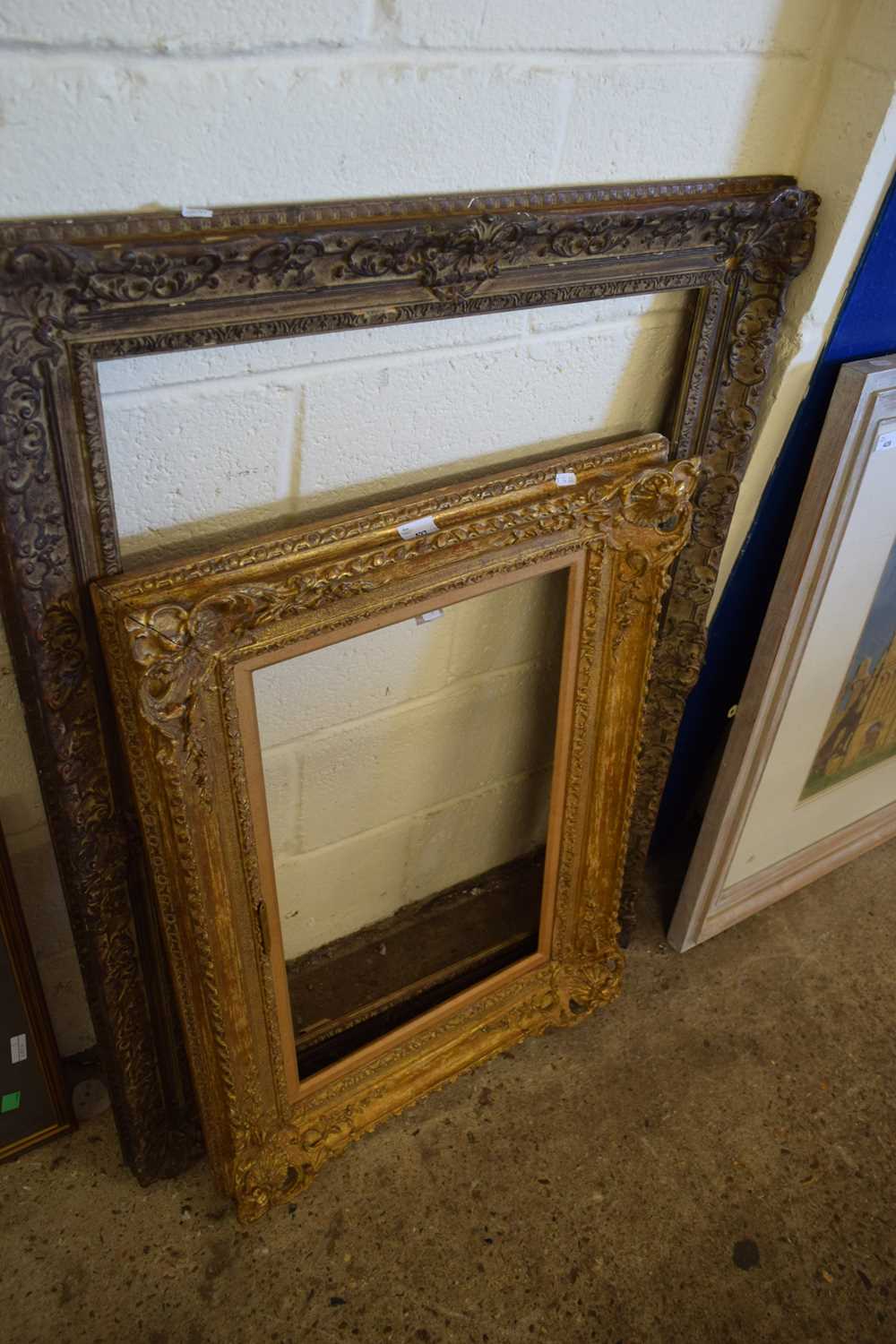 TWO PICTURE FRAMES WITH MOULDED AND GILT DECORATION, LARGEST 110CM HIGH (2)