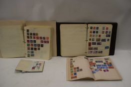 COLLECTION OF VARIOUS STAMPS IN A BLACK ALBUM PLUS FURTHER HOME-MADE ALBUM AND TWO SMALLER ALBUMS,