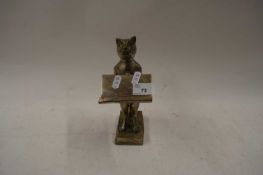 SMALL CAST METAL STAND FORMED AS A CAT