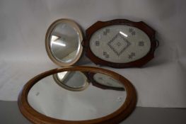 TWO OVAL MIRRORS AND A SMALL SERVING TRAY