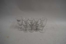 MIXED LOT NINE VARIOUS SMALL GLASS WINES AND SPIRIT GLASSES, SOME WITH ENGRAVED DECORATION