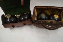 TWO CASES OF LAWN BOWLS