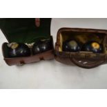 TWO CASES OF LAWN BOWLS