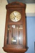 EARLY 20TH CENTURY OAK CASED WALL CLOCK