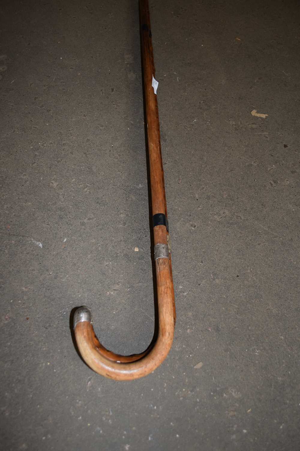 TWO VINTAGE WALKING CANES WITH SILVER/WHITE METAL BANDING