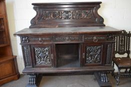 LARGE AND HEAVILY CARVED CONTINENTAL SIDEBOARD ON PAW FEET, 180CM WIDE