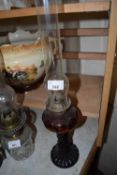 SMALL OIL LAMP WITH COLOURED GLASS BASE