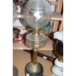 BRASS BASED OIL LAMP WITH CLEAR GLASS FONT AND FROSTED GLASS SHADE
