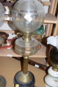 BRASS BASED OIL LAMP WITH CLEAR GLASS FONT AND FROSTED GLASS SHADE