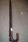 TWO ETHNIC HARDWOOD WALKING STICKS