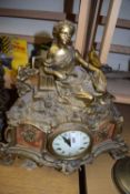 FRENCH BRASS CASED MANTEL CLOCK WITH FIGURAL MOUNTS