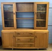 Ercol light elm sideboard with two doors and three drawers with glazed top section over, 155cm wide