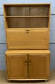 Ercol light elm cocktail cabinet, the top section with drop down front and fitted interior, over a