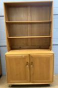 Ercol light elm side cabinet with shelved top section over a cupboard base, 91cm wide