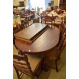 MODERN OAK VENEERED EXTENDING DINING TABLE AND SIX CHAIRS