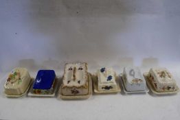 SIX VARIOUS WEDGE FORMED CHEESE AND BUTTER DISHES