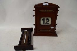 WOODEN CASE PERPETUAL DESK CALENDAR AND A WALL MOUNTED THERMOMETER (2)