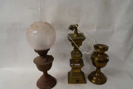TWO OIL LAMPS AND A FURTHER BRASS TABLE LAMP BASE