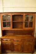 REPRODUCTION OAK TWO PIECE SIDEBOARD OR DRESSER WITH GLAZED TOP SECTION, 151CM WIDE