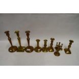 QUANTITY OF VARIOUS BRASS CANDLESTICKS