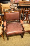 LATE 19TH CENTURY OAK FRAMED AND BROWN LEATHER UPHOLSTERED LARGE ARMCHAIR, 63CM WIDE