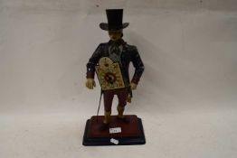 SMALL NOVELTY MANTEL CLOCK FORMED AS A METAL MAN IN TOP HAT