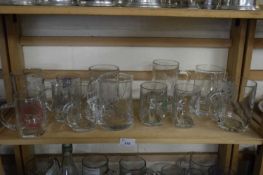 LARGE COLLECTION OF GLASS PINT TANKARDS AND OTHERS OF CRICKETING INTEREST, PLUS A FURTHER RHYL